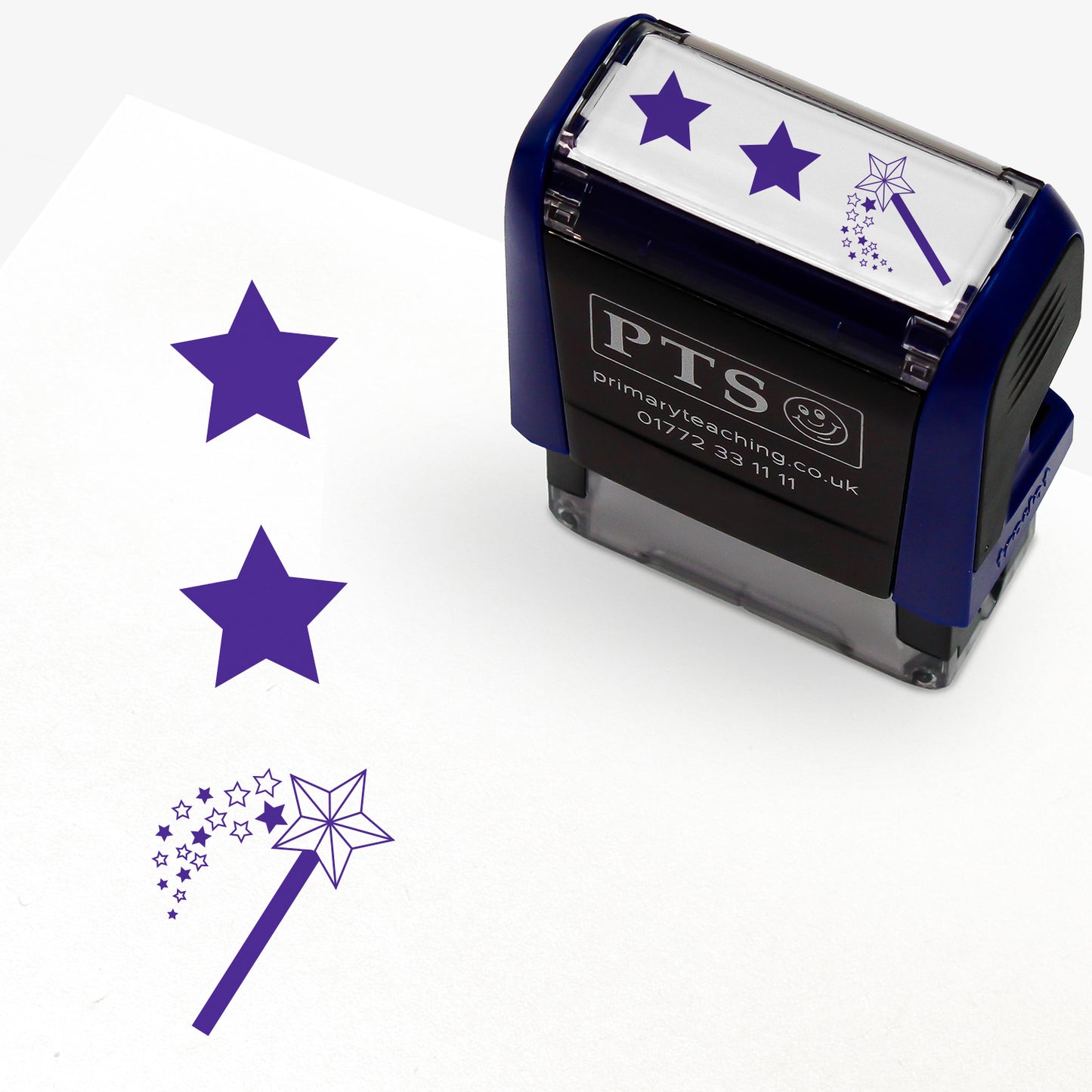 A rectangular pre-inked teacher stamper measuring 38mm x 15mm, featuring a green vertical impression: a star at the top, a star in the middle and a wand with a shower of stars underneath.