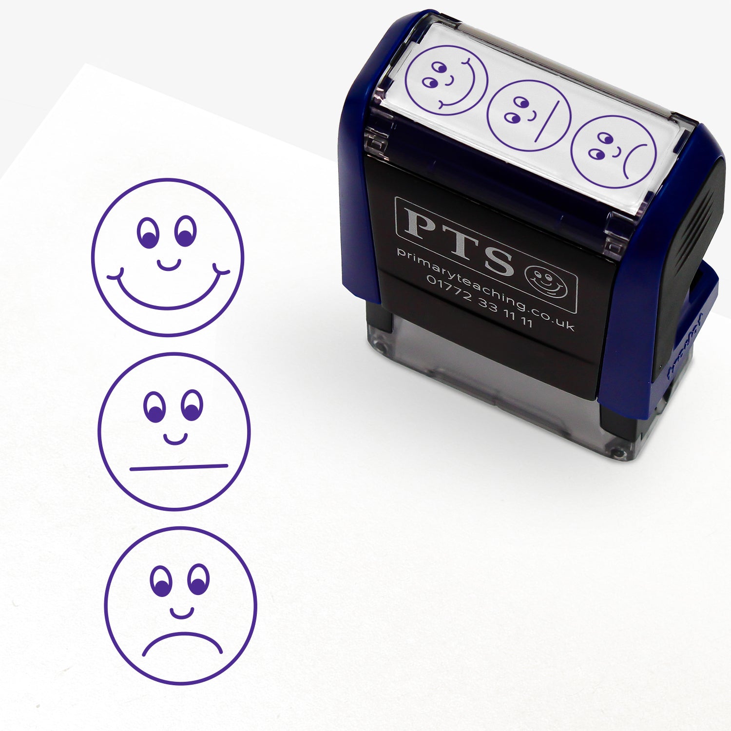 A rectangular pre-inked teacher stamper measuring 38mm x 15mm, featuring a purple vertical impression: Smiley face at top, non committal face in middle and sad face at bottom.