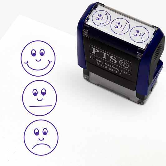 A rectangular pre-inked teacher stamper measuring 38mm x 15mm, featuring a purple vertical impression: Smiley face at top, non committal face in middle and sad face at bottom.