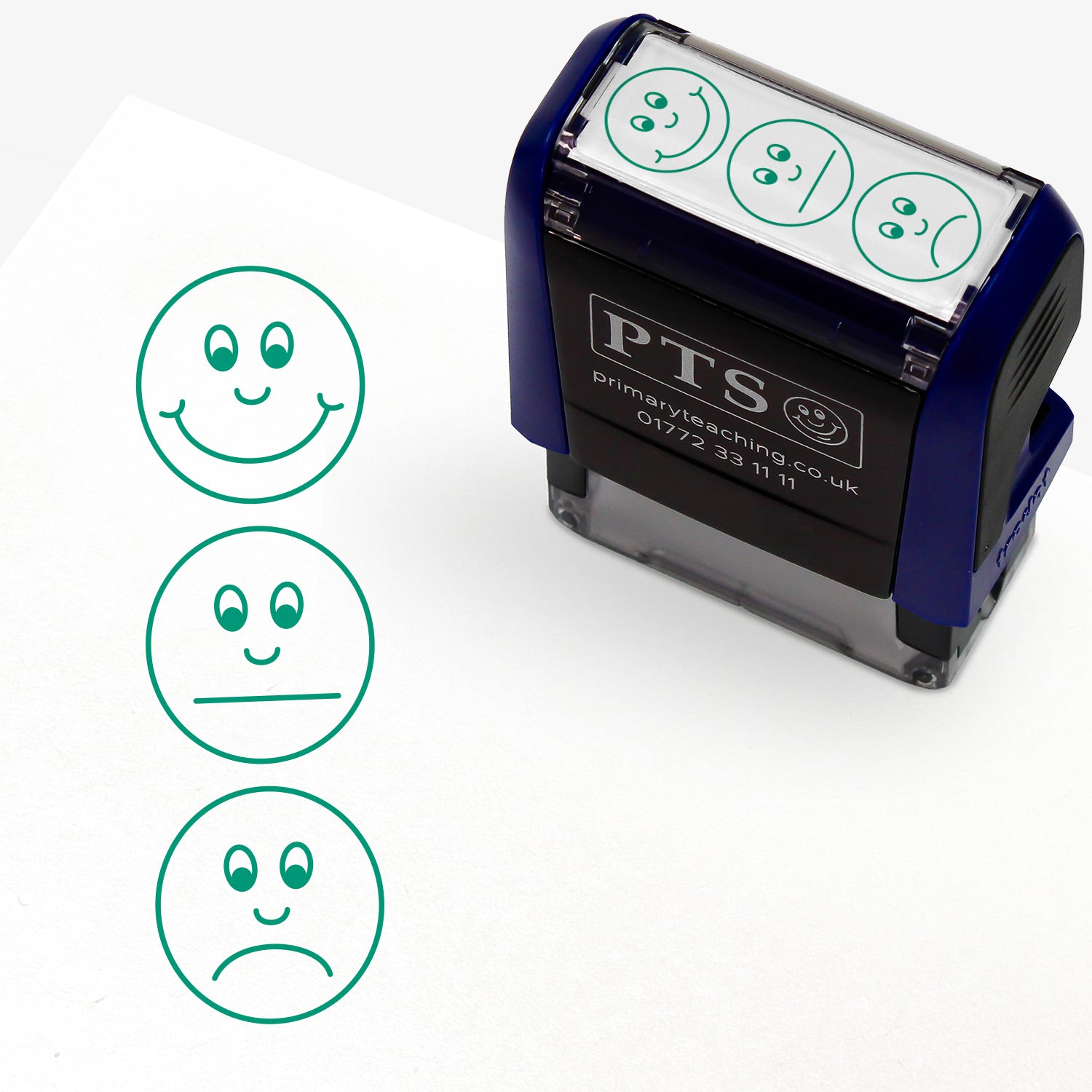 A rectangular pre-inked teacher stamper measuring 38mm x 15mm, featuring a green vertical impression: Smiley face at top, non committal face in middle and sad face at bottom.