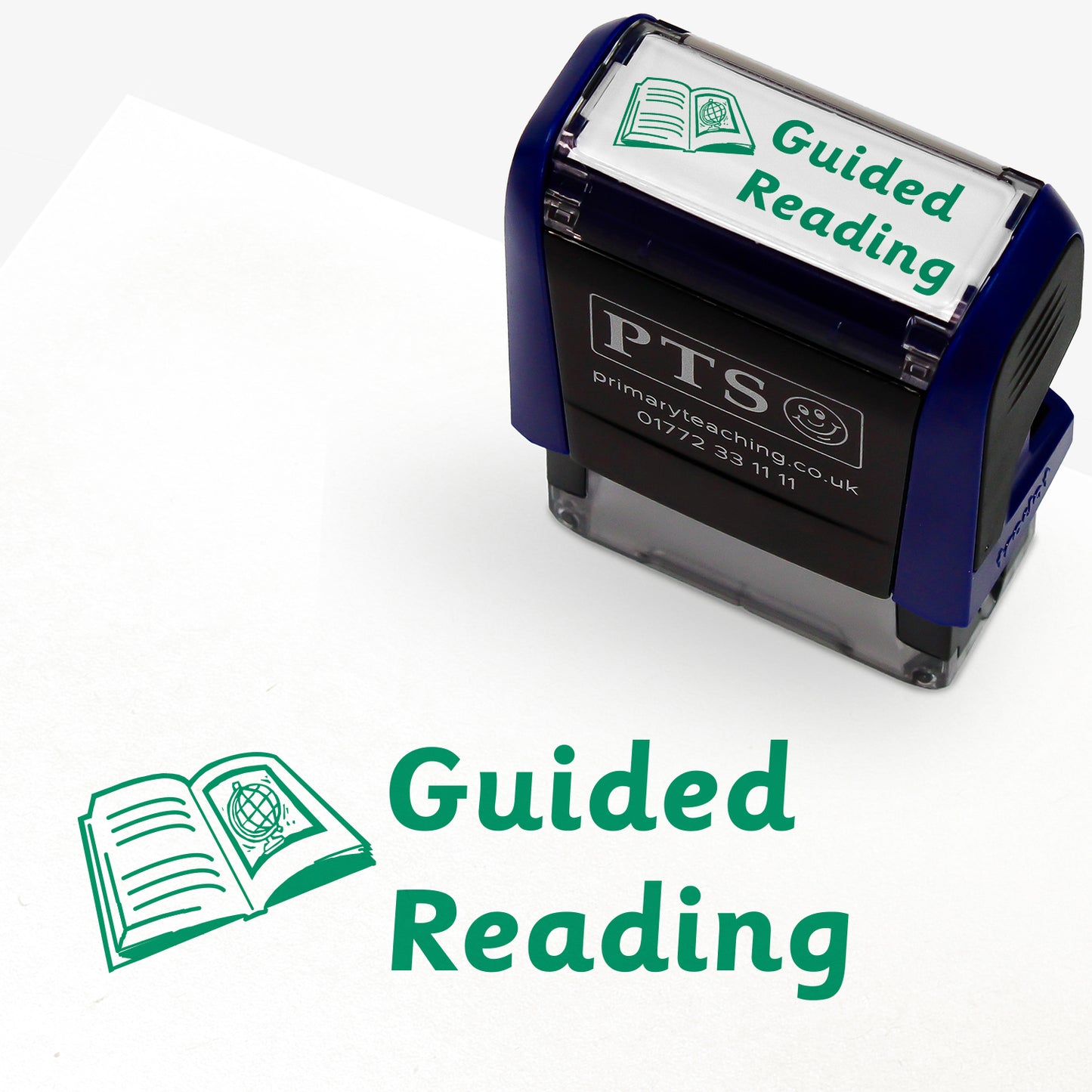 38mm x 15mm self-inking stamper featuring the phrase 'Guided Reading.' in bold green letters next to an illustration of an open book with lines on one page and a globe on the facing page.