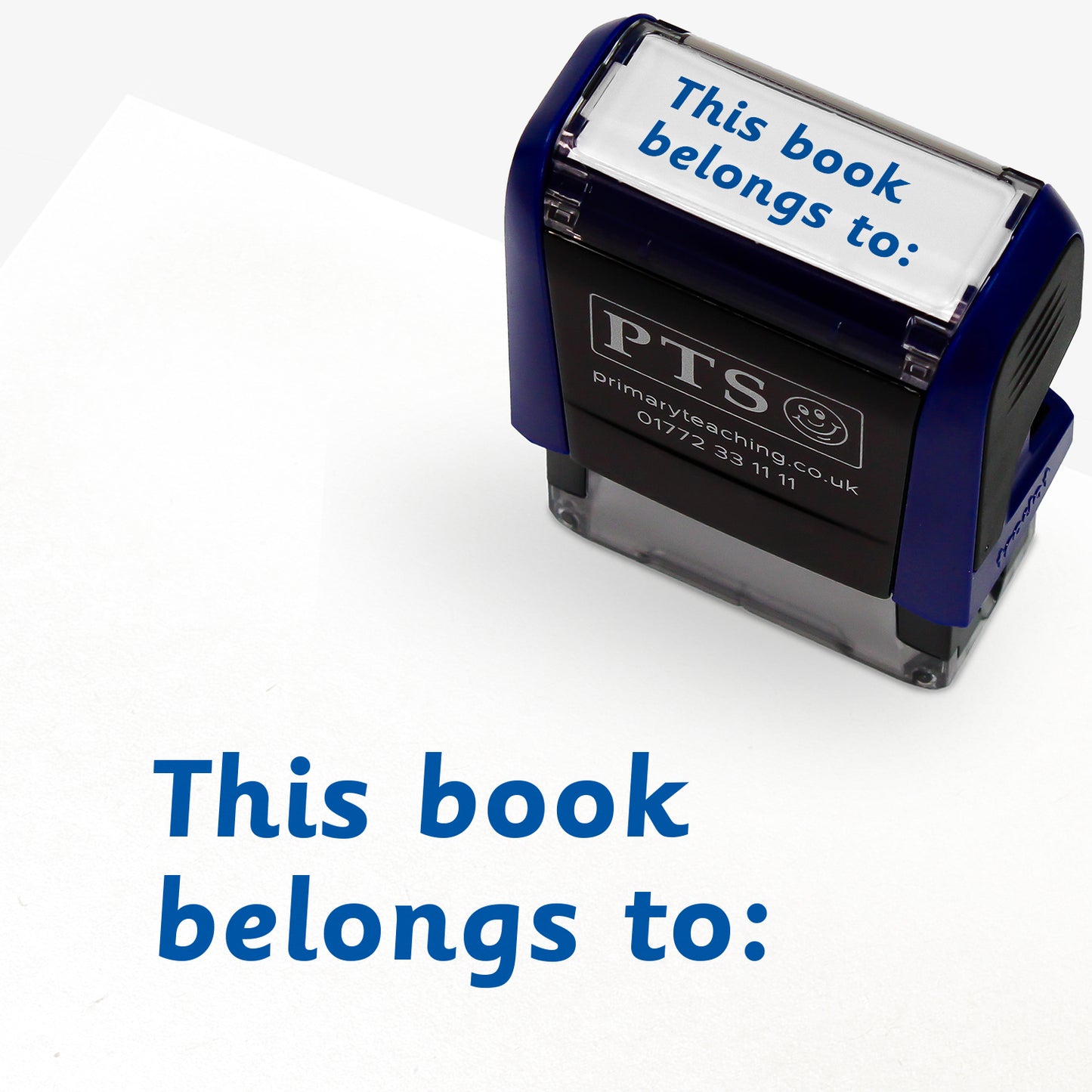Rectangular self-inking stamper with blue ink measuring 38mm by 15mm, featuring the phrase 'This book belongs to:' across two lines.