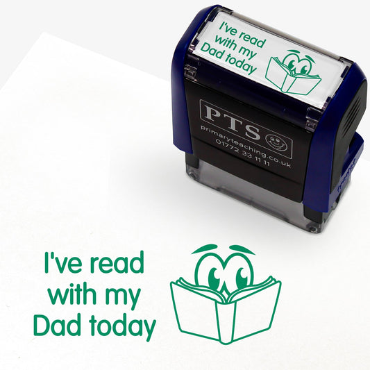 Rectangular self-inking stamper measuring 38mm by 15mm, featuring the phrase 'I've read with my dad today' in green text next to an illustration of an open book with 2 eyes peering over.