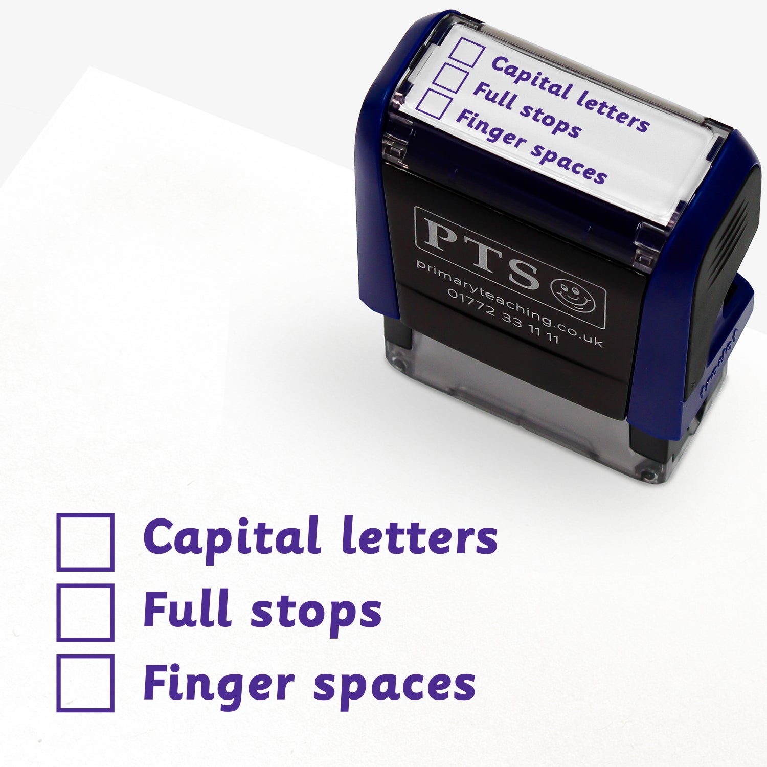 Rectangular self-inking stamper with purple ink measuring 38mm by 15mm, featuring the three phrases each with a tick box next to them.  Phrases are 'Capital letters', 'Full stops' and 'Finger spaces'