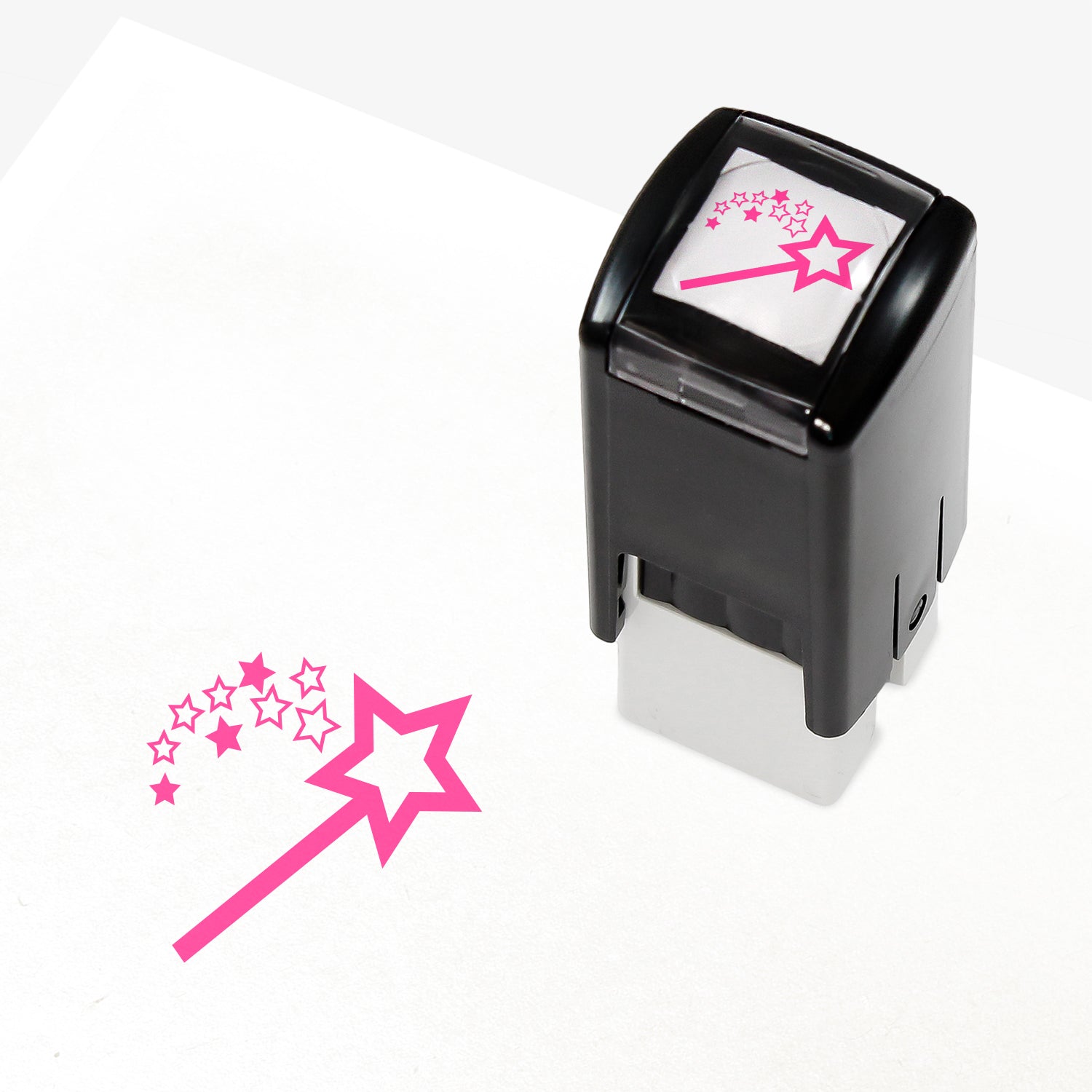 A 10mm self-inking stamp with a pink wand emitting a shower of stars.