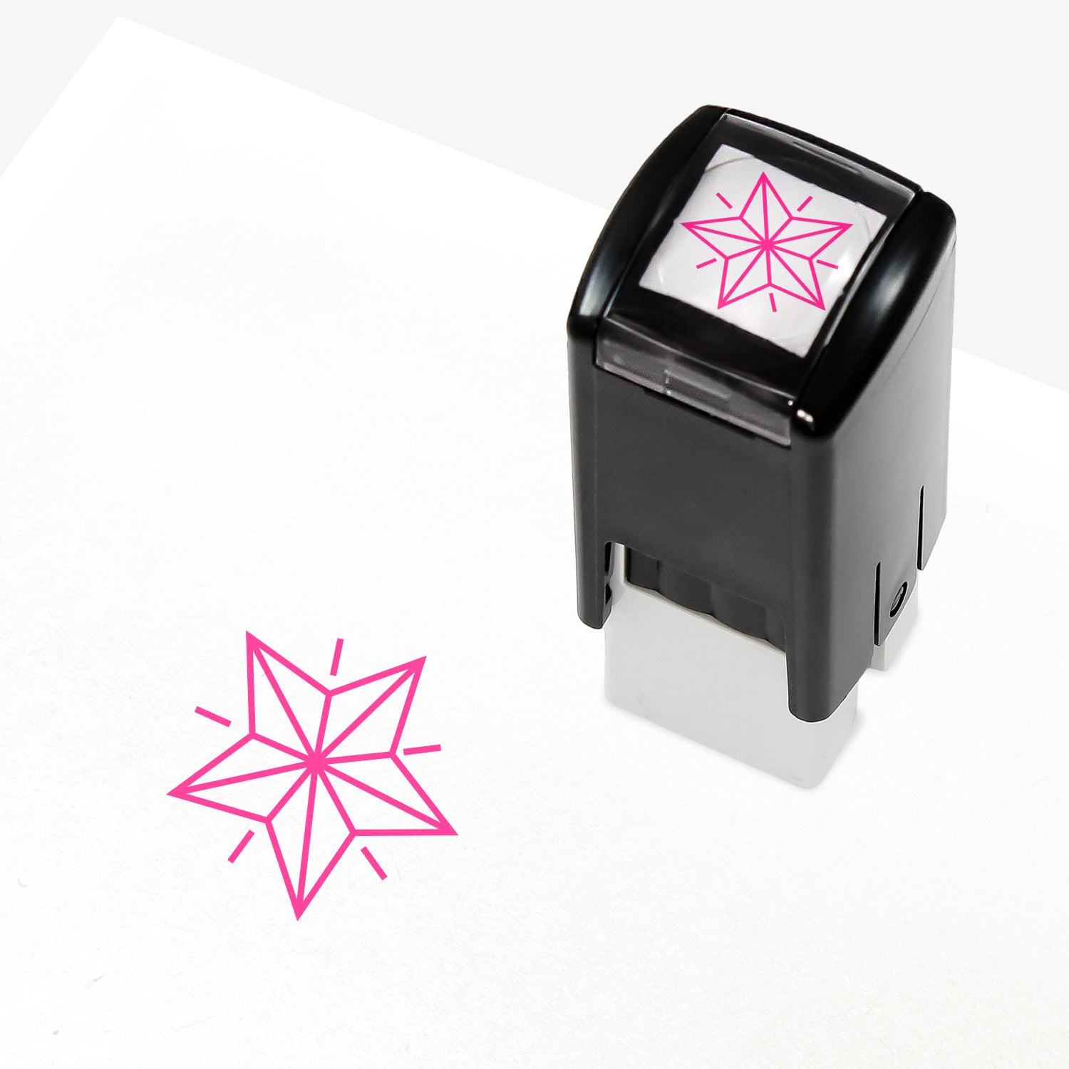 A 10mm self-inking stamp with a pink outline 3D style star central to the design.