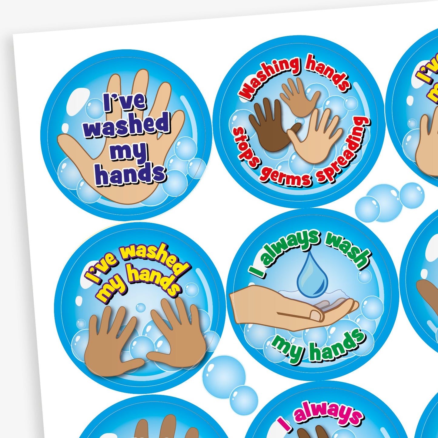 Close up of 32mm circular stickers with a cyan background featuring graphics of hands and bubbles.  Phrases include 'I'VE WASHED MY HANDS', 'WASHING HANDS STOPS GERMS SPREADING' and 'I ALWAYS WASH MY HANDS'
