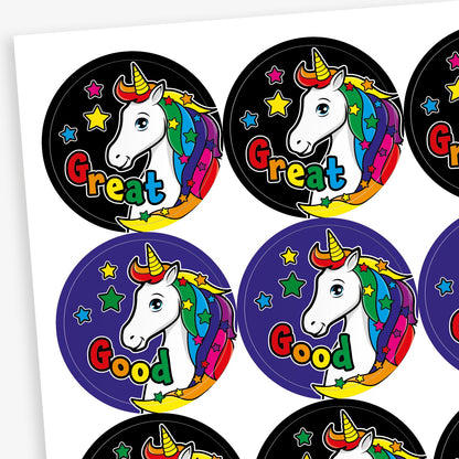 Sheet of 20 round vibrant-coloured stickers, each 32mm in diameter, featuring a white unicorn with a rainbow mane and horn, surrounded by stars. Each sticker displays one of five motivational words: 'Great', 'Magic', 'Super', 'Wow!', or 'Good'.