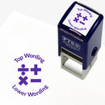 A 25mm round pre-inked teacher stamper in purple with a central design of mathematical symbols: division, multiplication, addition, and equals. The stamp includes customisable text above and below the symbols.