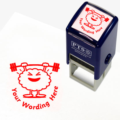 A 25mm round pre-inked teacher stamper with red ink, featuring a brain lifting weights above it's head, curving below the image is space for personalisation 'Your Wording Here' in a clear, bold font.