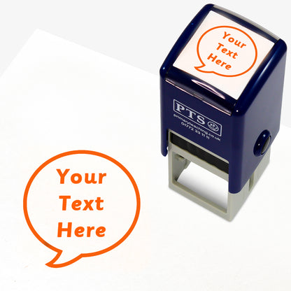 A 25mm round pre-inked teacher stamper with orange ink, featuring a a speech bubble within which the space for personalisation 'Your Text Here' in a clear, bold font.