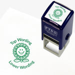 A 25mm round pre-inked teacher stamper with green ink, featuring a smiling sunflower, curving above the image is space for personalisation 'Top Wording' and curving below the image is space for personalisation 'Lower Wording' in a clear, bold font.