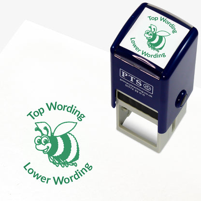 A 25mm round pre-inked teacher stamper with green ink, featuring a smiling bee, curving above the image is space for personalisation 'Top Wording' and curving below the image is space for personalisation 'Lower Wording' in a clear, bold font.