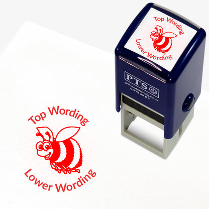 A 25mm round pre-inked teacher stamper with red ink, featuring a smiling bee, curving above the image is space for personalisation 'Top Wording' and curving below the image is space for personalisation 'Lower Wording' in a clear, bold font.