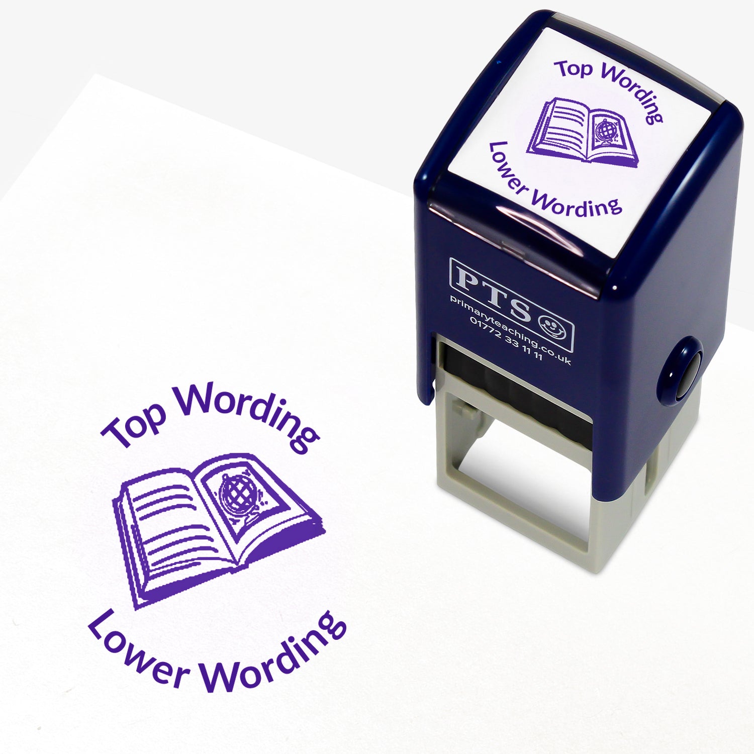 A 25mm round pre-inked teacher stamper with purple ink, featuring a open book with lines on the left page and a picture of a globe on the right page, curving above the image is space for personalisation 'Top Wording' and curving below the image is space for personalisation 'Lower Wording' in a clear, bold font.