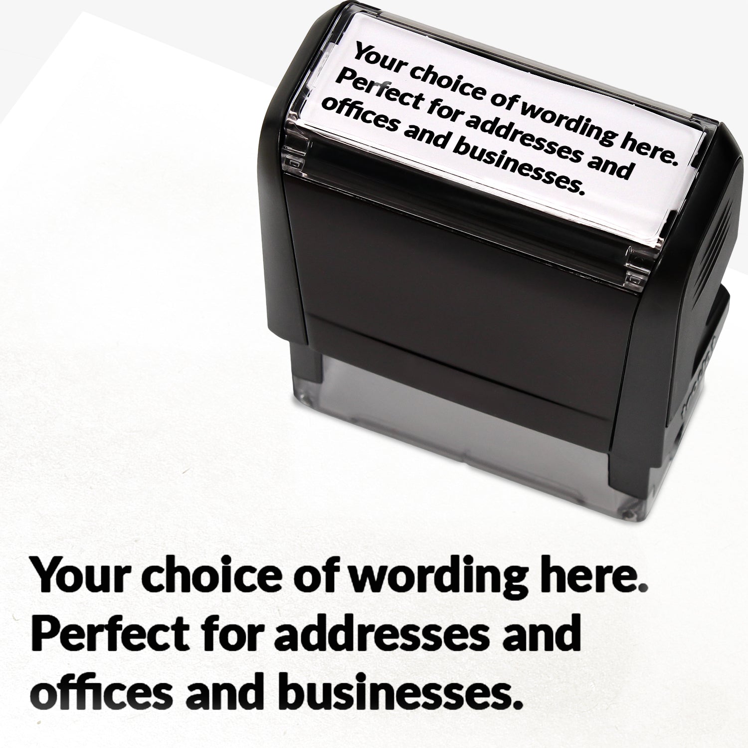 Rectangular self-inking stamper measuring 58mm by 22mm with black ink; featuring the space for personalisation 'Your choice of wording here. Perfect stamper for addresses and offices and businesses.' in a clear, bold font across 3 lines