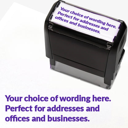 Rectangular self-inking stamper measuring 58mm by 22mm with purple ink; featuring the space for personalisation 'Your choice of wording here. Perfect stamper for addresses and offices and businesses.' in a clear, bold font across 3 lines