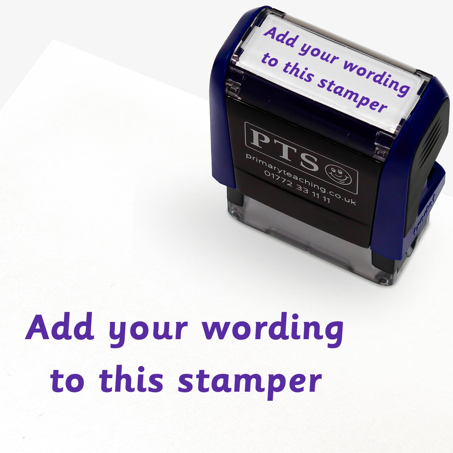 Customisable self-inking teacher stamper sized 18mm x 14mm.  The stamp imprint shows 2 lines saying 'Add your wording to this stamper' in purple text, indicating personalisation options.