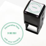 A self-inking stamp with green ink. The impression within a green circle includes the date '31 DEC 2031' in the centre, with the green text 'Personalise here' curved along the top edge and 'with your wording' along the bottom edge of the circle.