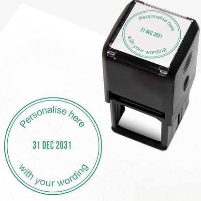 A self-inking stamp with green ink. The impression within a green circle includes the date '31 DEC 2031' in the centre, with the green text 'Personalise here' curved along the top edge and 'with your wording' along the bottom edge of the circle.