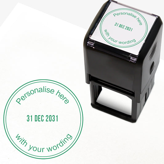 A self-inking stamp with green ink. The impression within a green circle includes the date '31 DEC 2031' in the centre, with the green text 'Personalise here' curved along the top edge and 'with your wording' along the bottom edge of the circle.