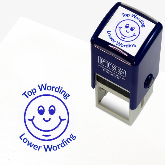 A 25mm round pre-inked teacher stamper with blue ink, featuring a smiling face, curving above the image is space for personalisation 'Top Wording' and curving below the image is space for personalisation 'Lower Wording' in a clear, bold font.