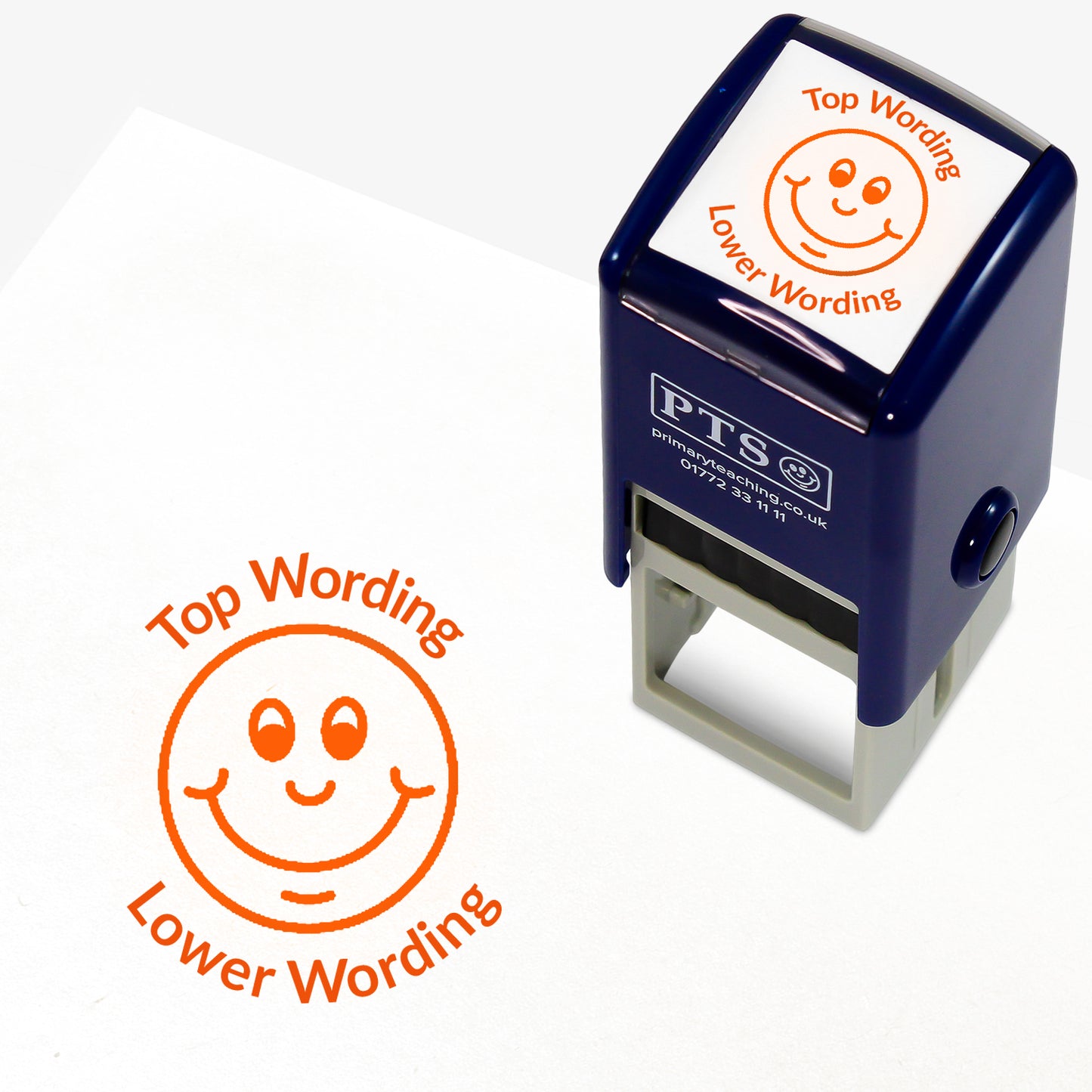 A 25mm round pre-inked teacher stamper with orange ink, featuring a smiling face, curving above the image is space for personalisation 'Top Wording' and curving below the image is space for personalisation 'Lower Wording' in a clear, bold font.