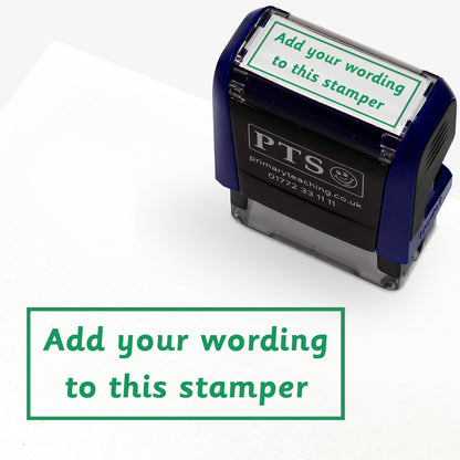 Rectangular self-inking stamper measuring 38mm by 15mm, featuring the phrase 'Add your wording to this stamper' within a text box across 2 lines, in green ink.