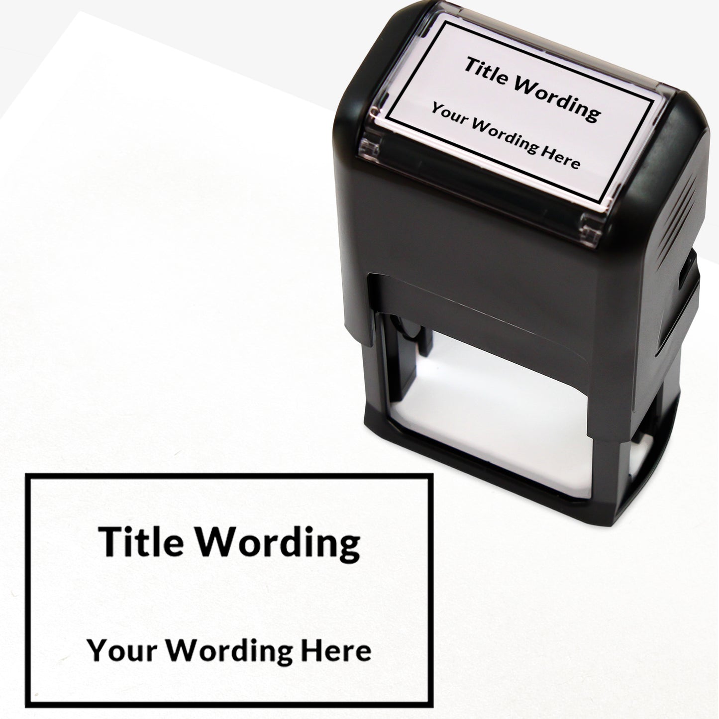 Rectangular self-inking stamper measuring 41mm by 24mm, featuring the phrase 'Title Wording' and 'Your Wording Here' within a text box across 2 lines, in black ink.