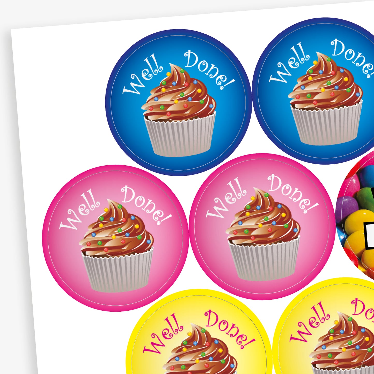 Sheet of 32mm chocolate-scented reward stickers featuring assorted colourful designs, including smiling chocolate characters, cupcakes, doughnuts, and sweets, each displaying motivational phrases like 'Well Done' and 'Amazing Work'; designed for rewarding pupils' achievements.