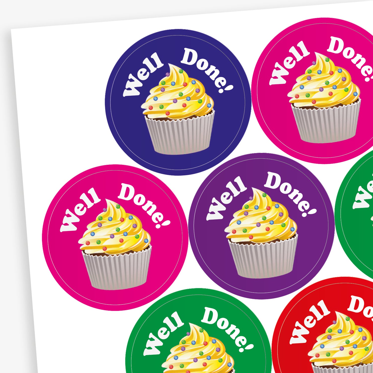 A sheet of circular, vanilla scented stickers, each with a cupcake with vanilla frosting as the main image below the phrase 'Well Done!'.  Colourful backgrounds of blue, magenta and green are shown.