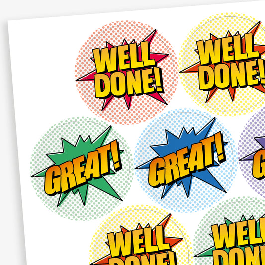 Sheet of sherbet scented colourful round stickers with comic book-style designs. Stickers feature bold text such as 'WELL DONE!' and 'GREAT!' in yellow with black outlines, set against vibrant starburst shapes in red, green, blue, and other colours.