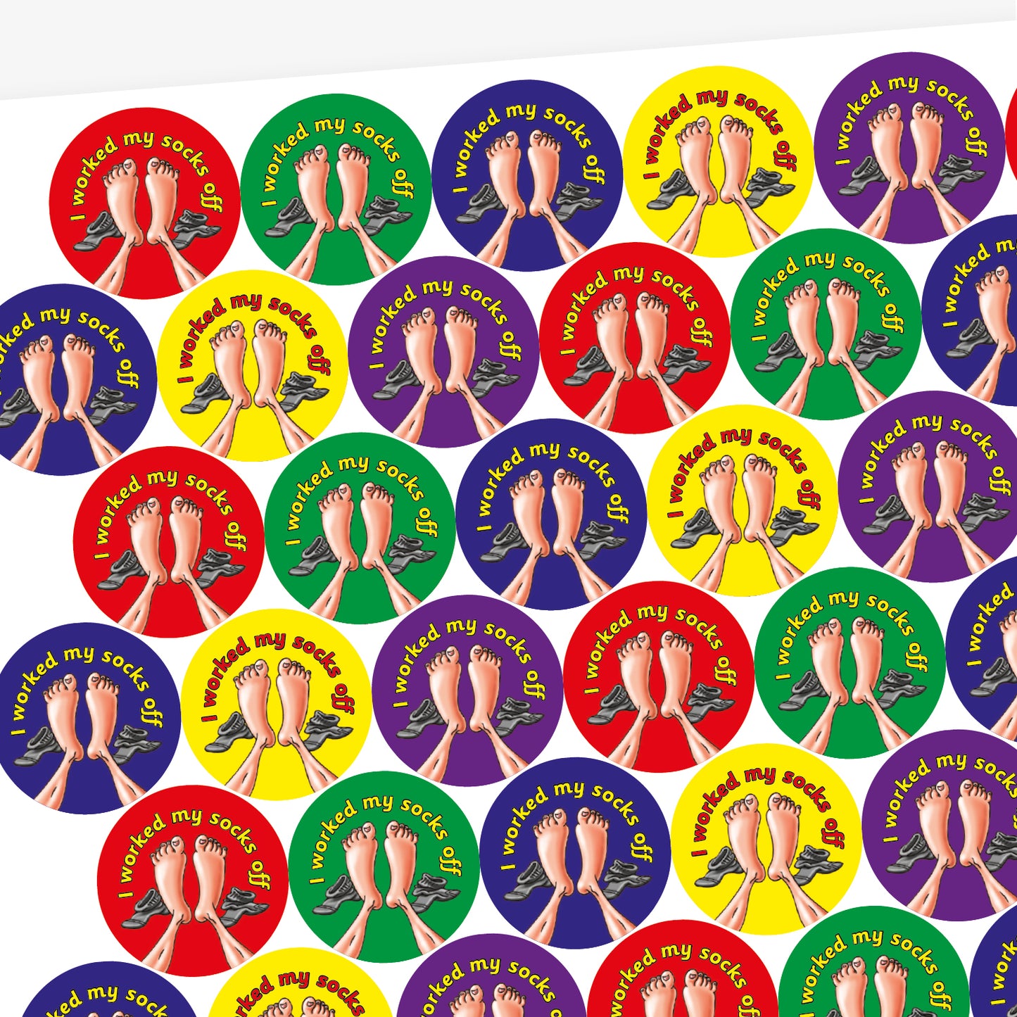 A sheet of circular stickers with clean linen scent.  Each featuring a a pair of feet with socks to the side on brightly coloured backgrounds of red, purple, yellow, blue and green.  Phrase above the image is 'I worked my socks off'