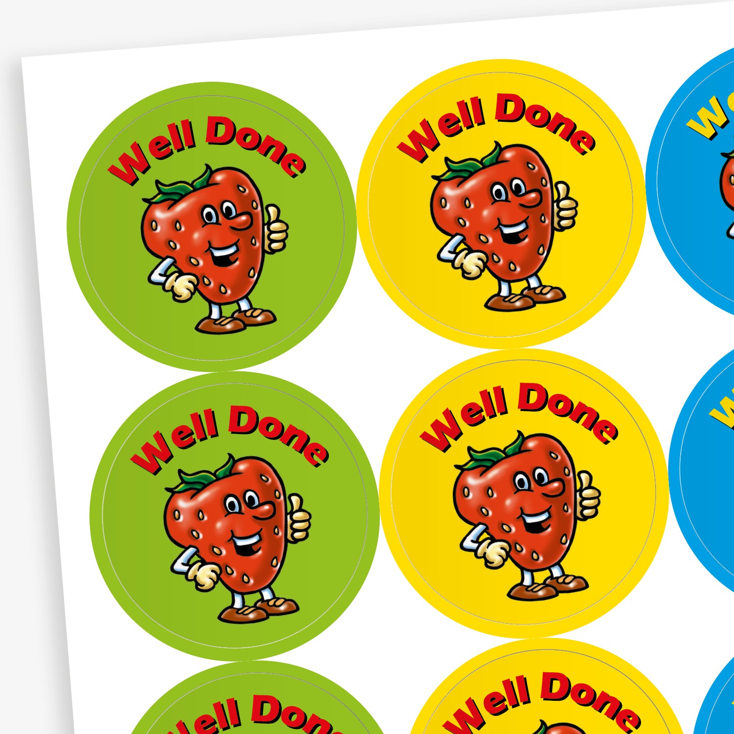 Sheet of strawberry scented, colourful round reward stickers featuring a smiling cartoon strawberry character giving a thumbs up. Each sticker has the text 'Well Done' at the top and comes in green, yellow, red, and blue backgrounds.