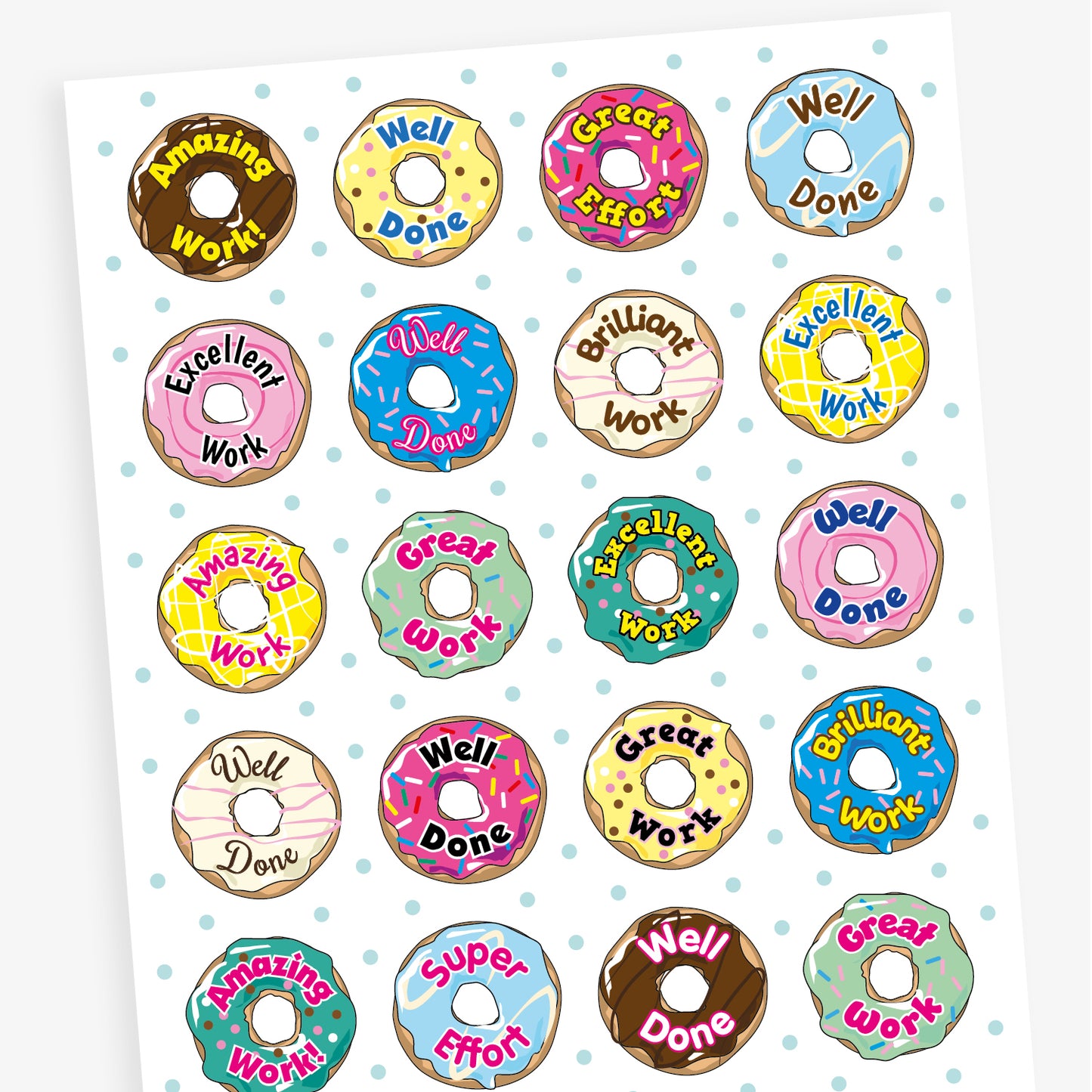 Sheet of 32mm vanilla-scented doughnut stickers in assorted pastel colours, each featuring phrases like 'Well Done', 'Great Work', and 'Brilliant Effort' in bold fonts; designed for rewarding pupils' achievements.