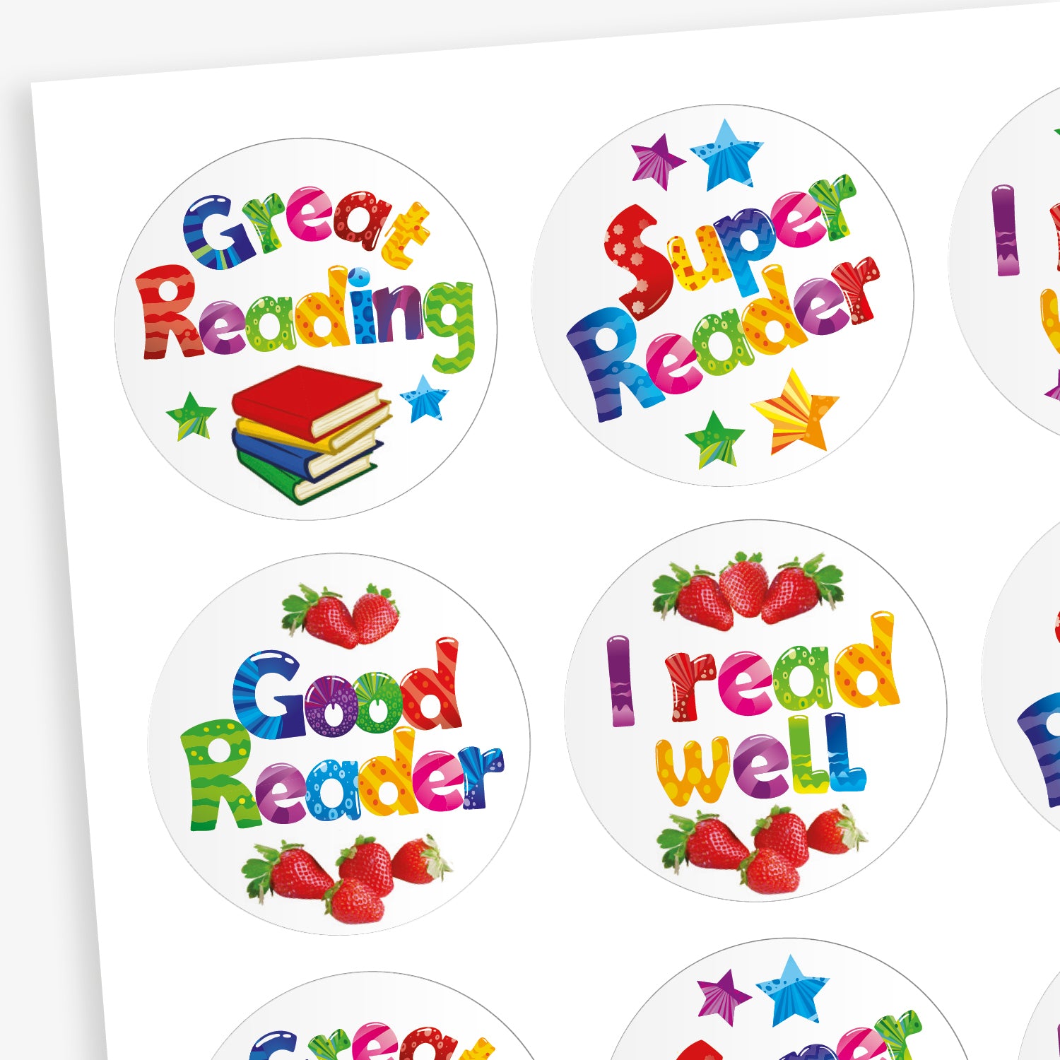 Sheet of strawberry scented round reward stickers with colourful text promoting reading achievements. Messages include 'Great Reading', 'Super Reader', 'Good Reader', and 'I read well', with accompanying illustrations of stars, strawberries, and a stack of books. Each sticker features vibrant, multicoloured lettering on a white background.