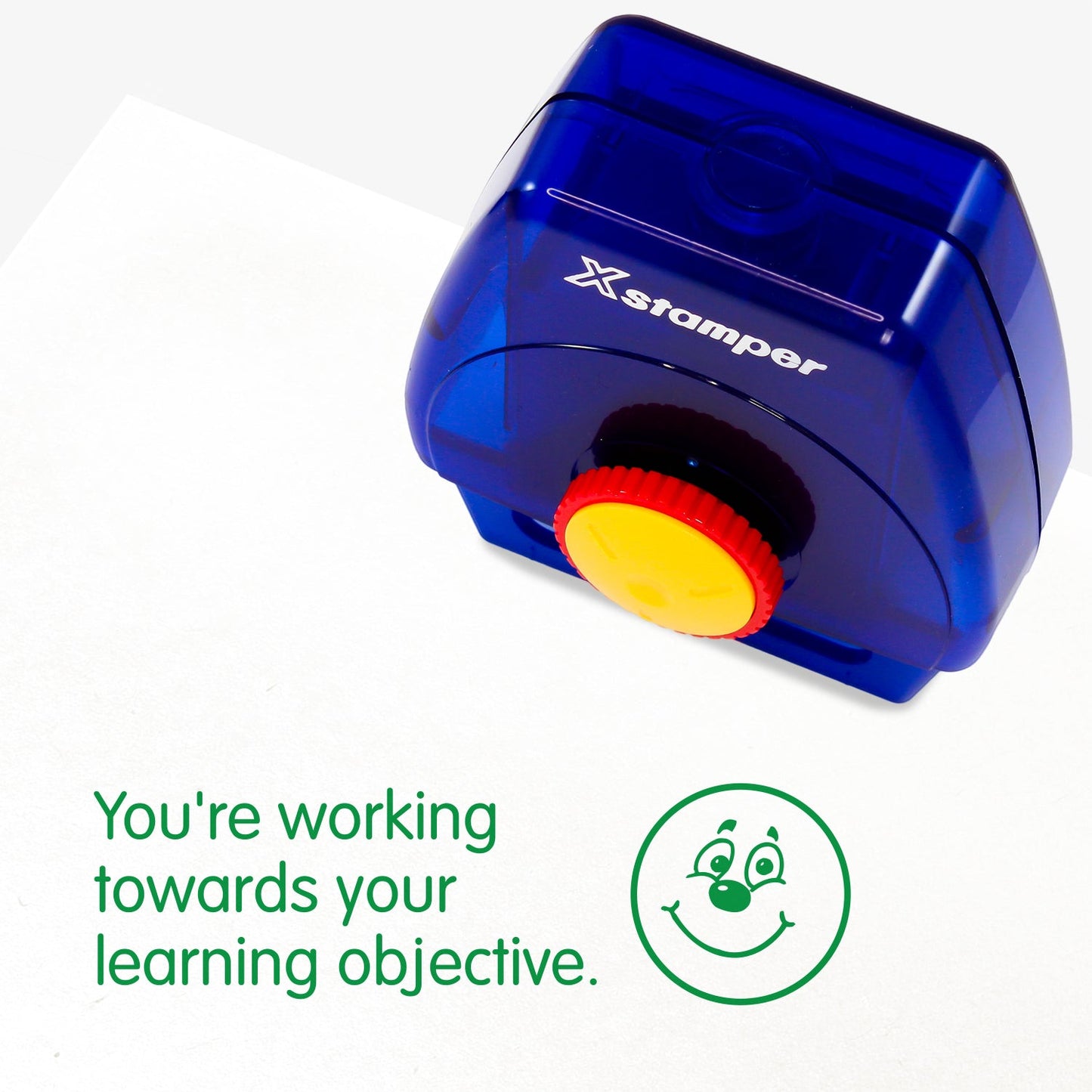 One Twist N Stamp brick in green ink.  A smiling face alongside the phrase 'You're working towards your learning objective' 